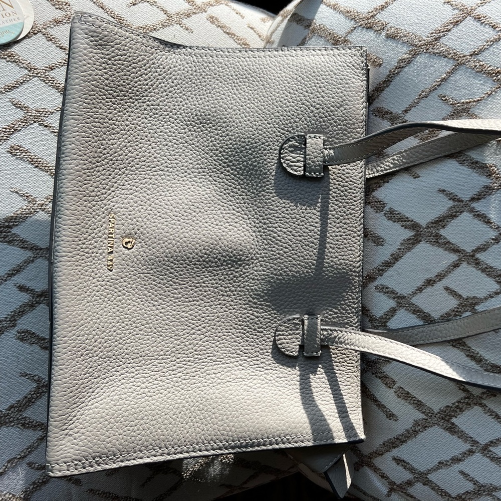 Spartina, taupe leather tote bag. Inside pockets, top zipper closure.